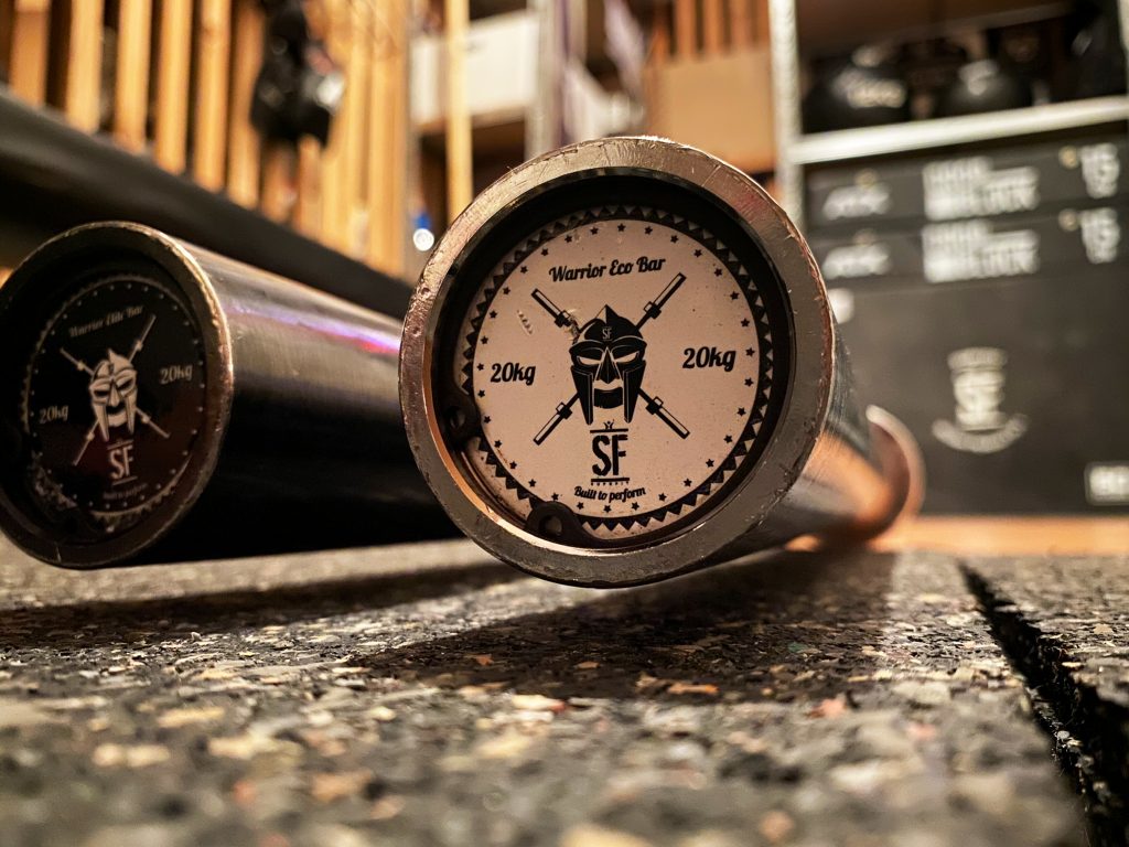 Suprfit Warrior Elite Bar on a home gym floor